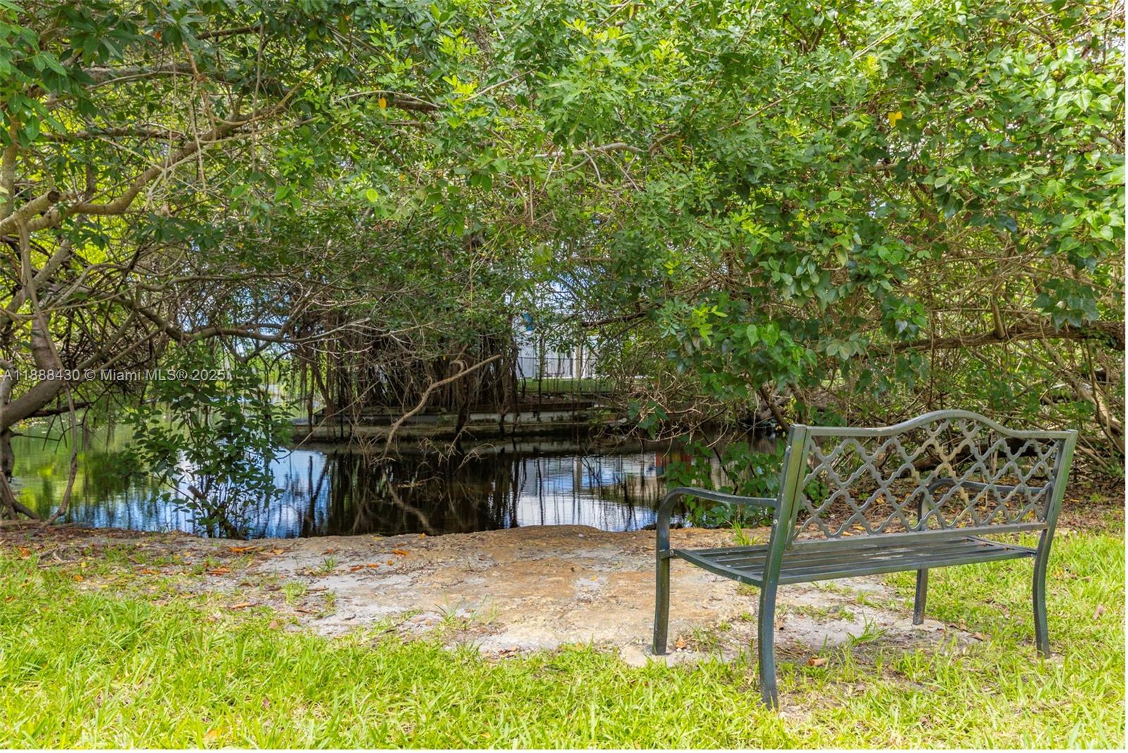 19440 Northeast 26th Avenue, Unit 53B Miami, FL 33180 - Photo 29 of 33 a view of a house with a yard