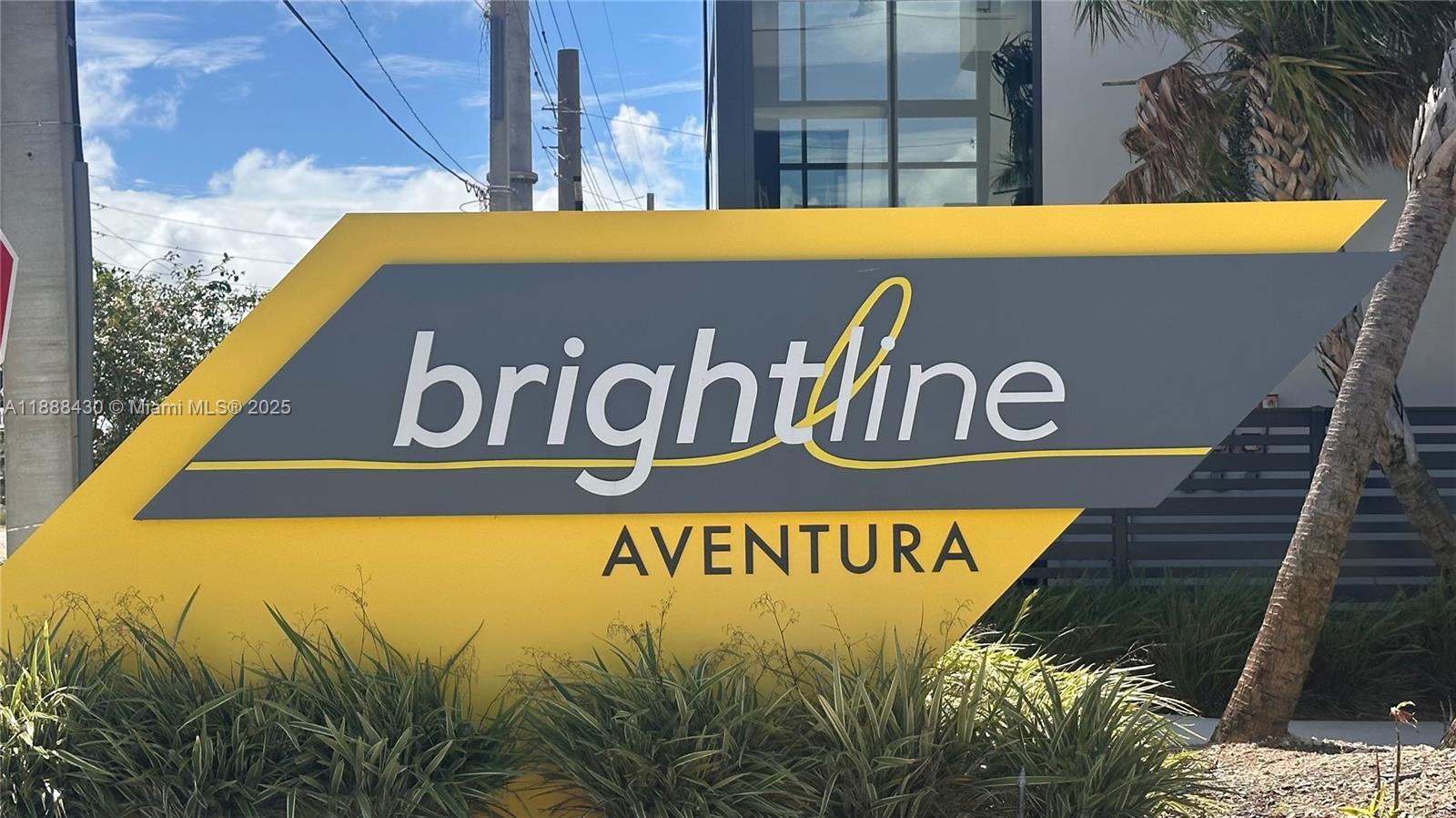 19440 Northeast 26th Avenue, Unit 53B Miami, FL 33180 - Photo 30 of 33 a sign broad on a brick wall