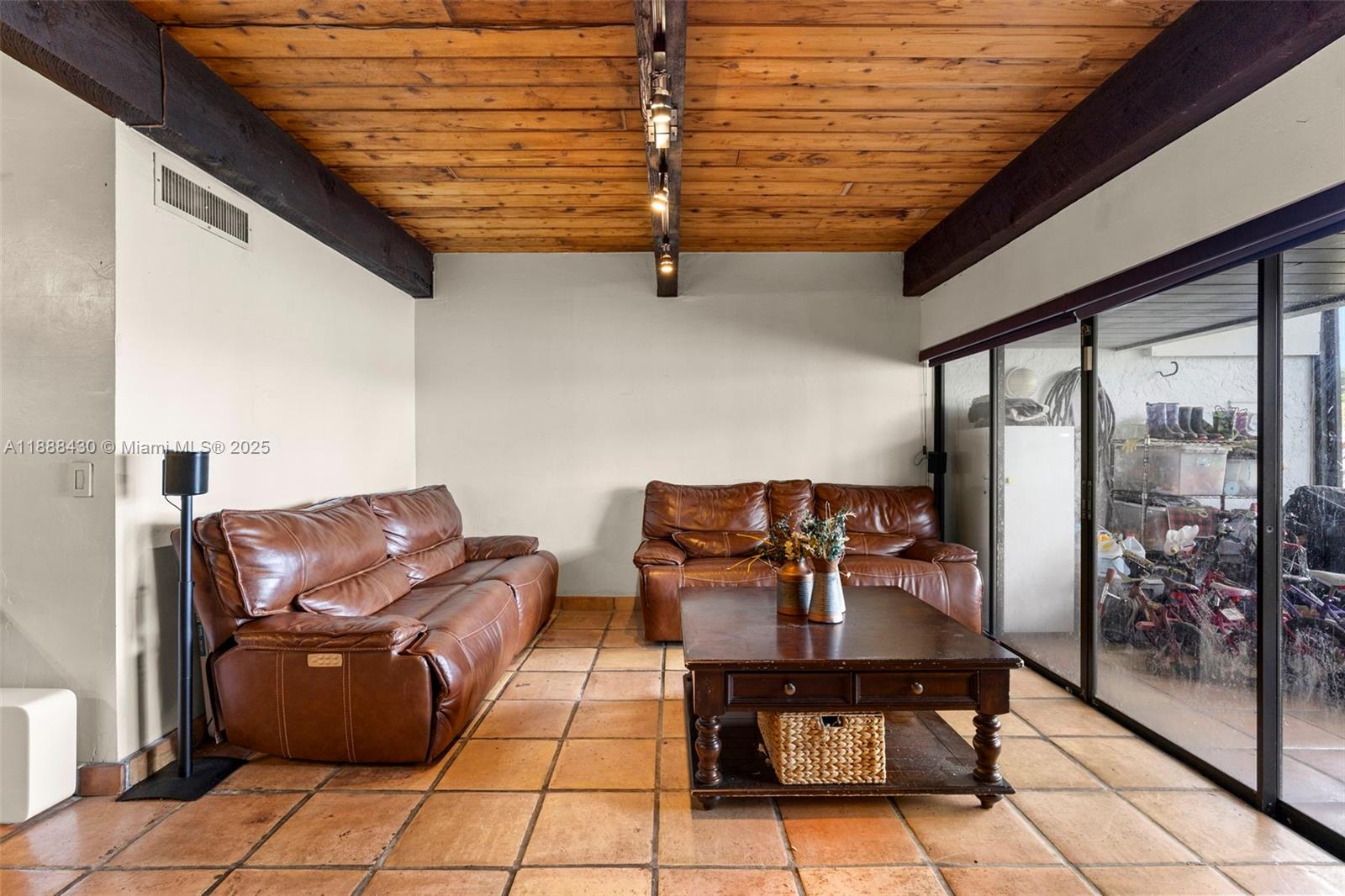 19440 Northeast 26th Avenue, Unit 53B Miami, FL 33180 - Photo 3 of 33 a outdoor living space with furniture