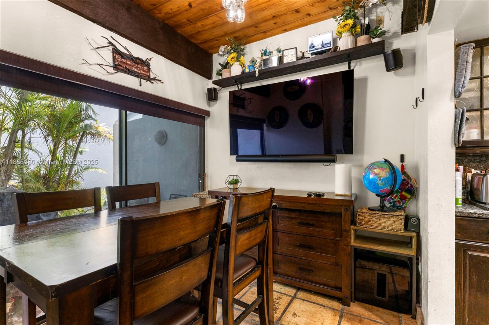 19440 Northeast 26th Avenue, Unit 53B Miami, FL 33180 - Photo 7 of 33 a view of dinning table and chairs in the patio