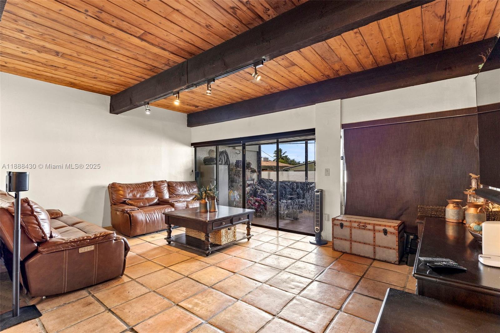 19440 Northeast 26th Avenue, Unit 53B Miami, FL 33180 - Photo 9 of 33 a outdoor living space with furniture