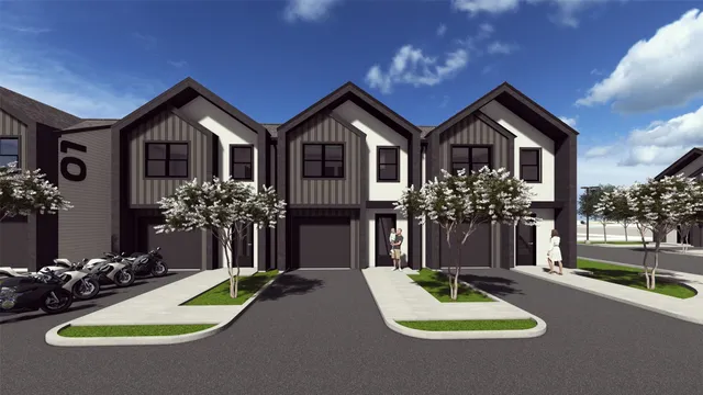 a front view of a house with yard and green space