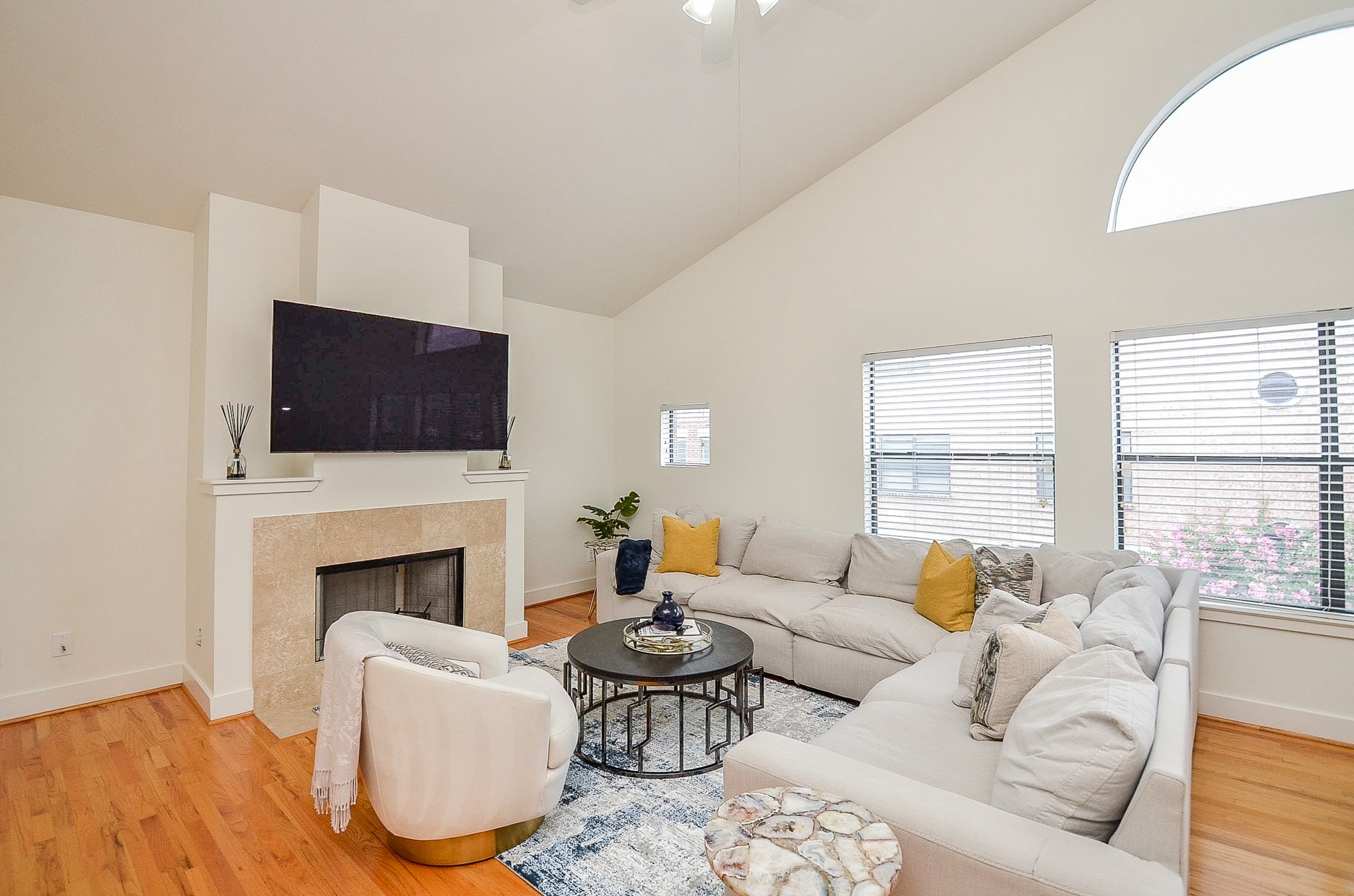 3413 Rolgom Pl Court Houston, TX 77021 - Photo 8 of 20 Living room with large windows, Hardwood floors and fireplace.