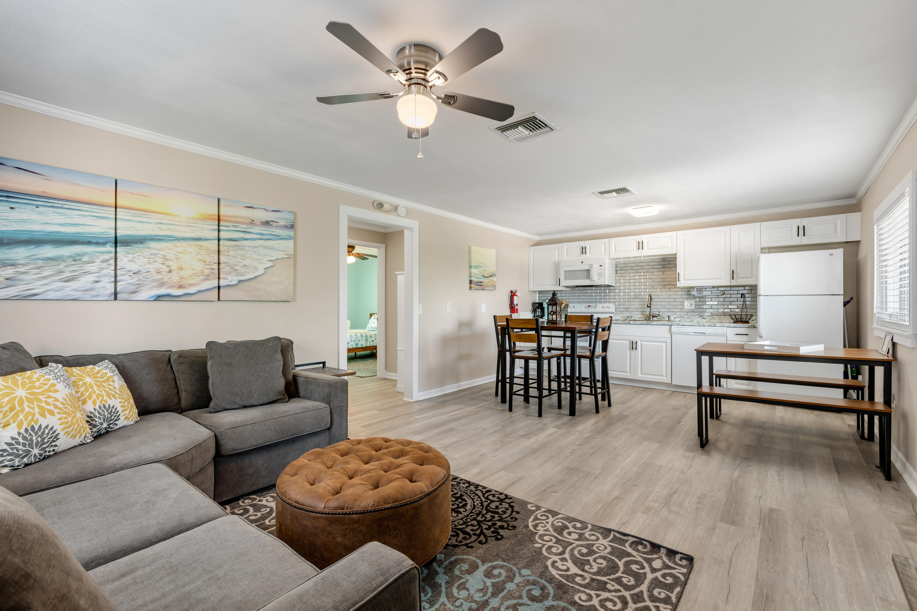 280-290 3rd Street Key Colony Beach, FL 33051 - Photo 18 of 28 a living room with furniture a ceiling fan and a window