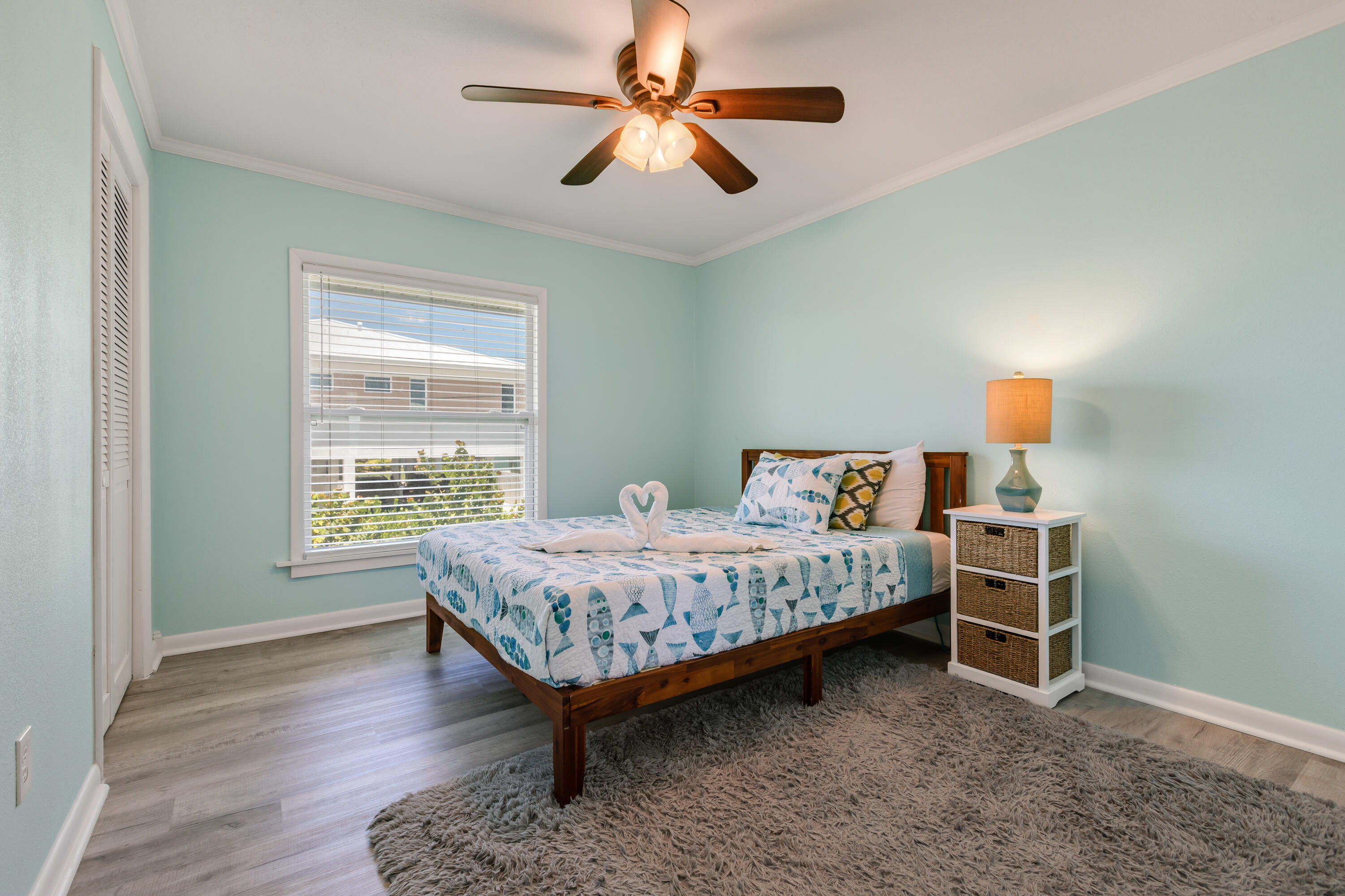 280-290 3rd Street Key Colony Beach, FL 33051 - Photo 21 of 28 a bedroom with a bed and a chandelier