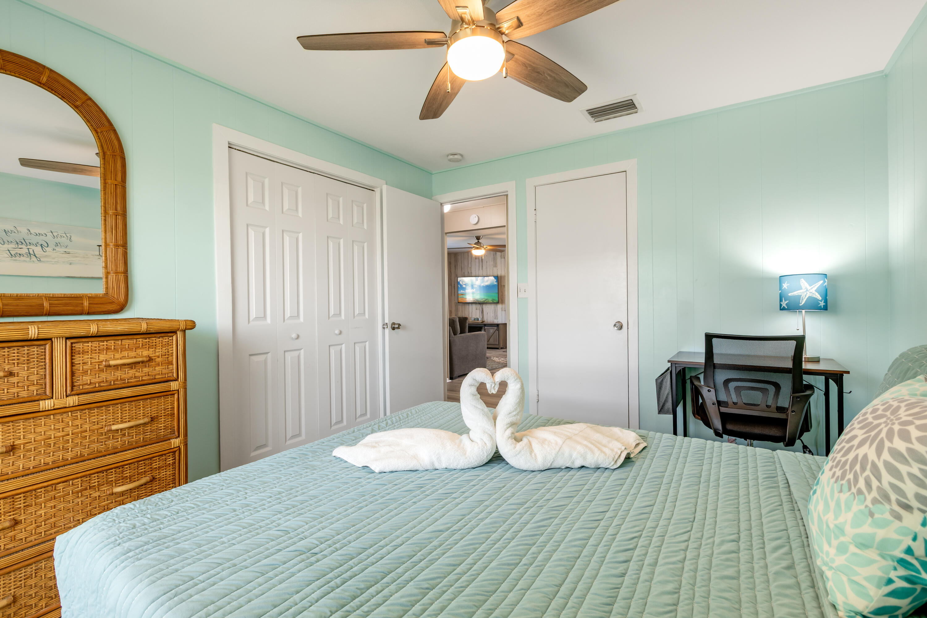 280-290 3rd Street Key Colony Beach, FL 33051 - Photo 7 of 28 a bedroom with a bed and wooden floor