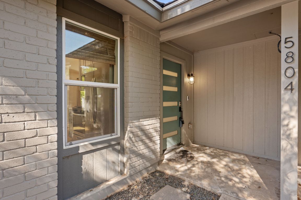 a view of a door and wooden floor