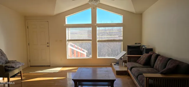 a living room with furniture and a window
