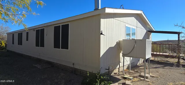 a front view of a house with sitting area