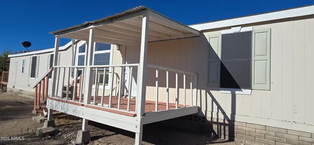 a view of balcony with wooden floor and stairs