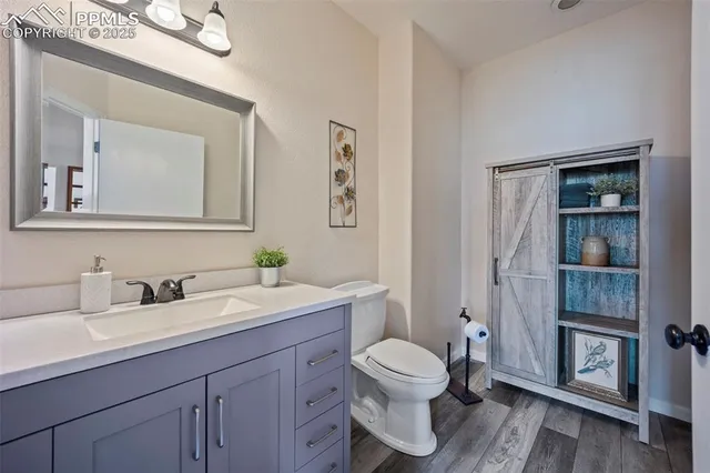 a living room with furniture a fireplace and a large window