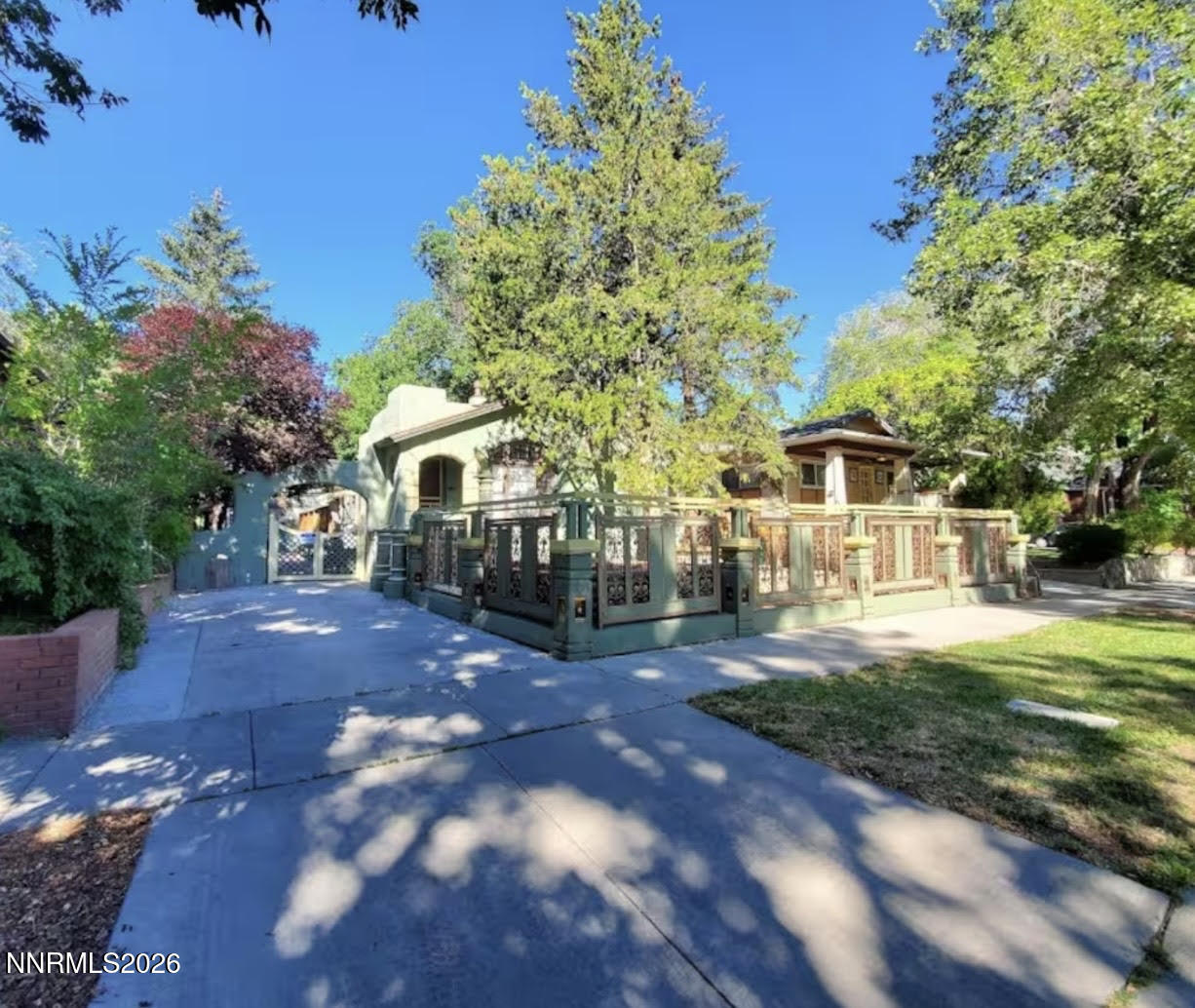 611 Nixon Avenue Reno, NV 89509 - Photo 1 of 43 a front view of a house with a garden