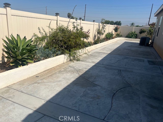 7561 Baerss Road Riverside, CA 92507 - Photo 21 of 24 BACKYARD WITH CONCRETE HARDSCAPE