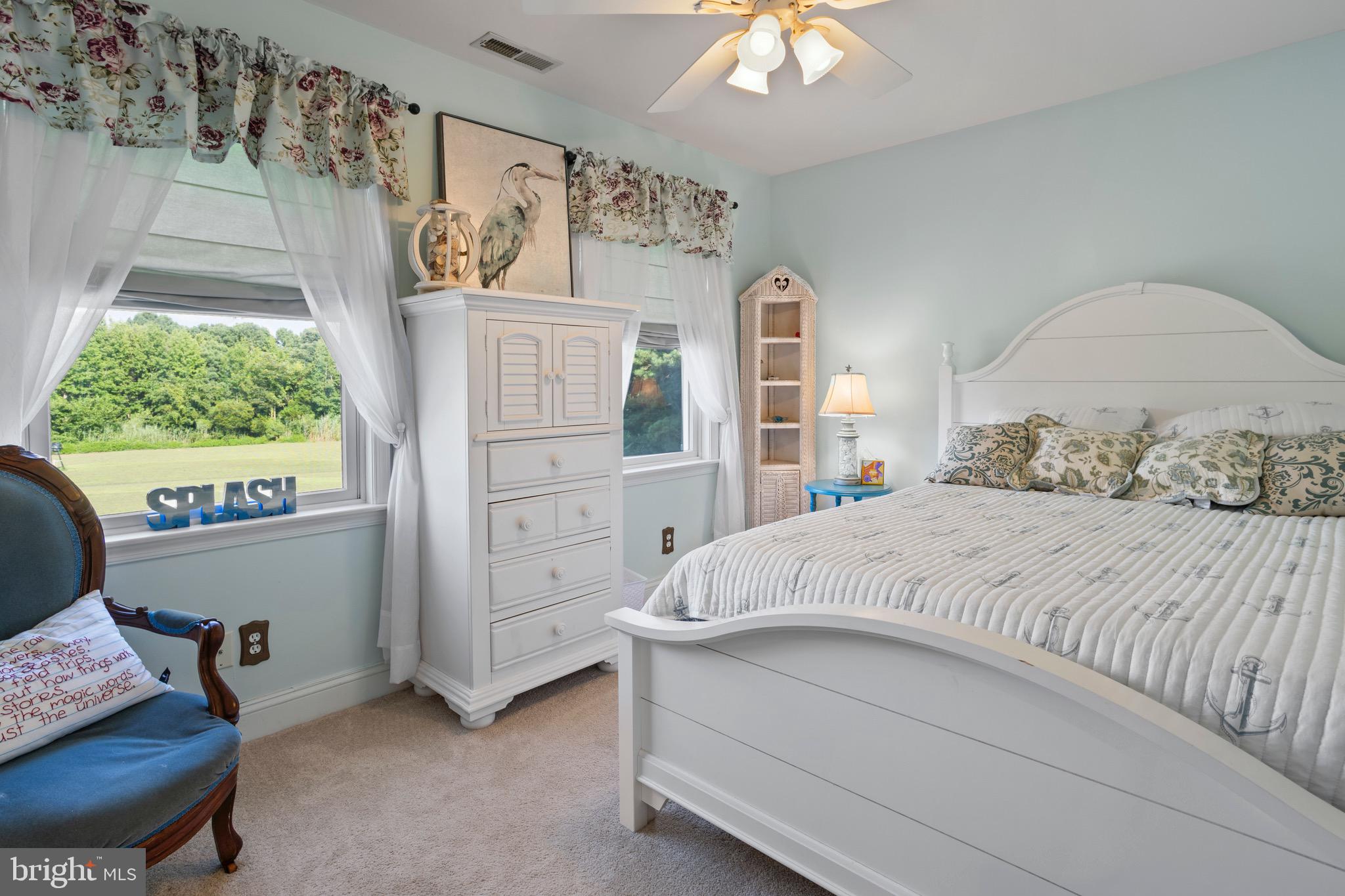 4957 Bar Neck Road Tilghman, MD 21671 - Photo 34 of 45 a bedroom with a bed and a window