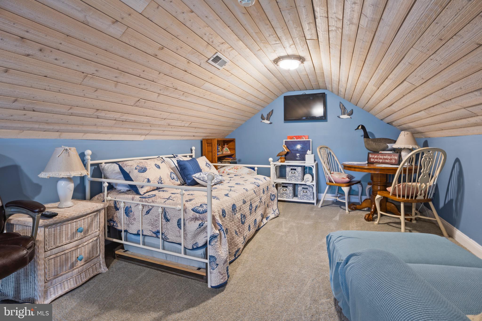 4957 Bar Neck Road Tilghman, MD 21671 - Photo 36 of 45 a bed room with a bed and furniture