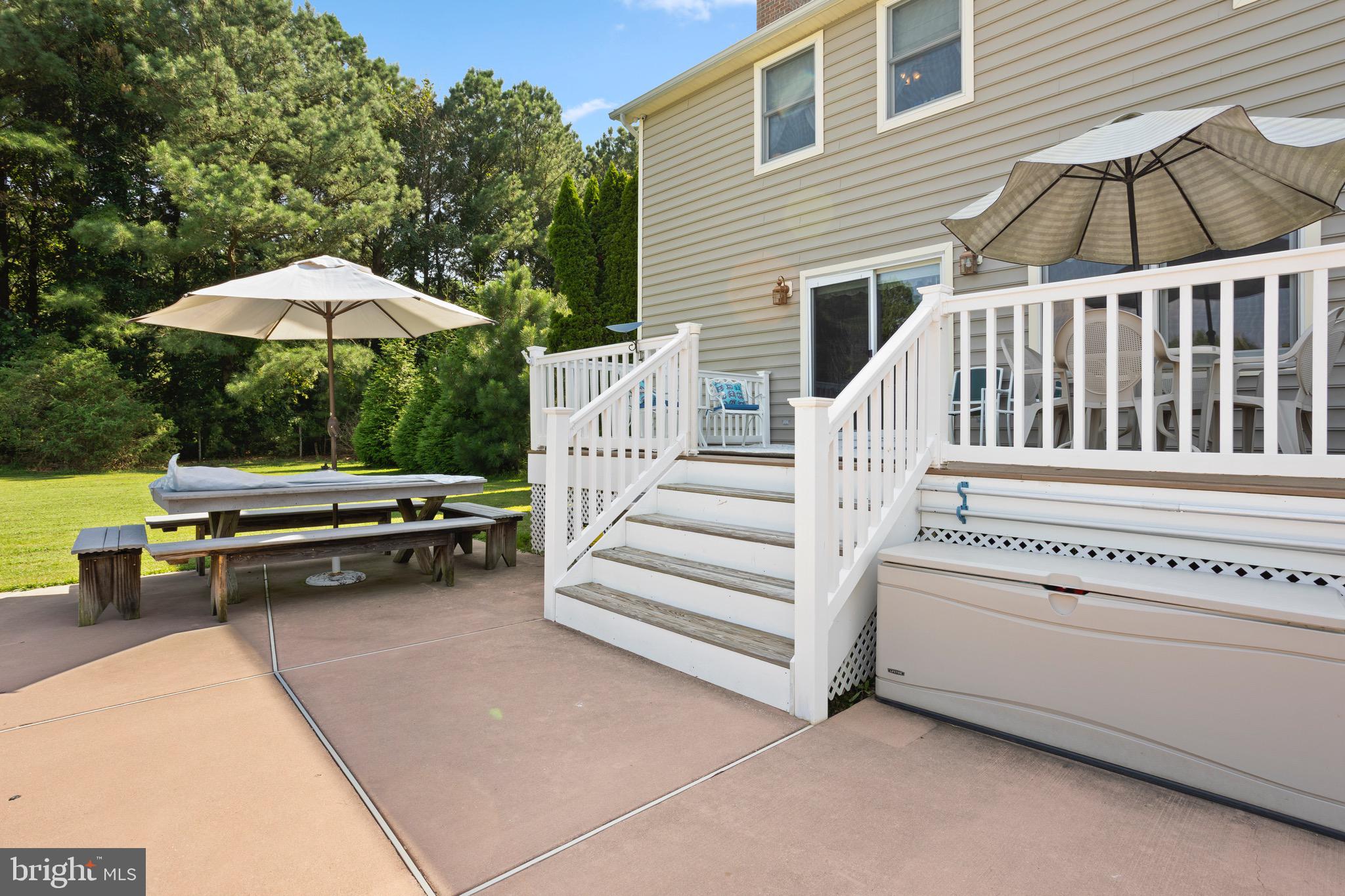 4957 Bar Neck Road Tilghman, MD 21671 - Photo 40 of 45 a view of a patio with a table and chairs
