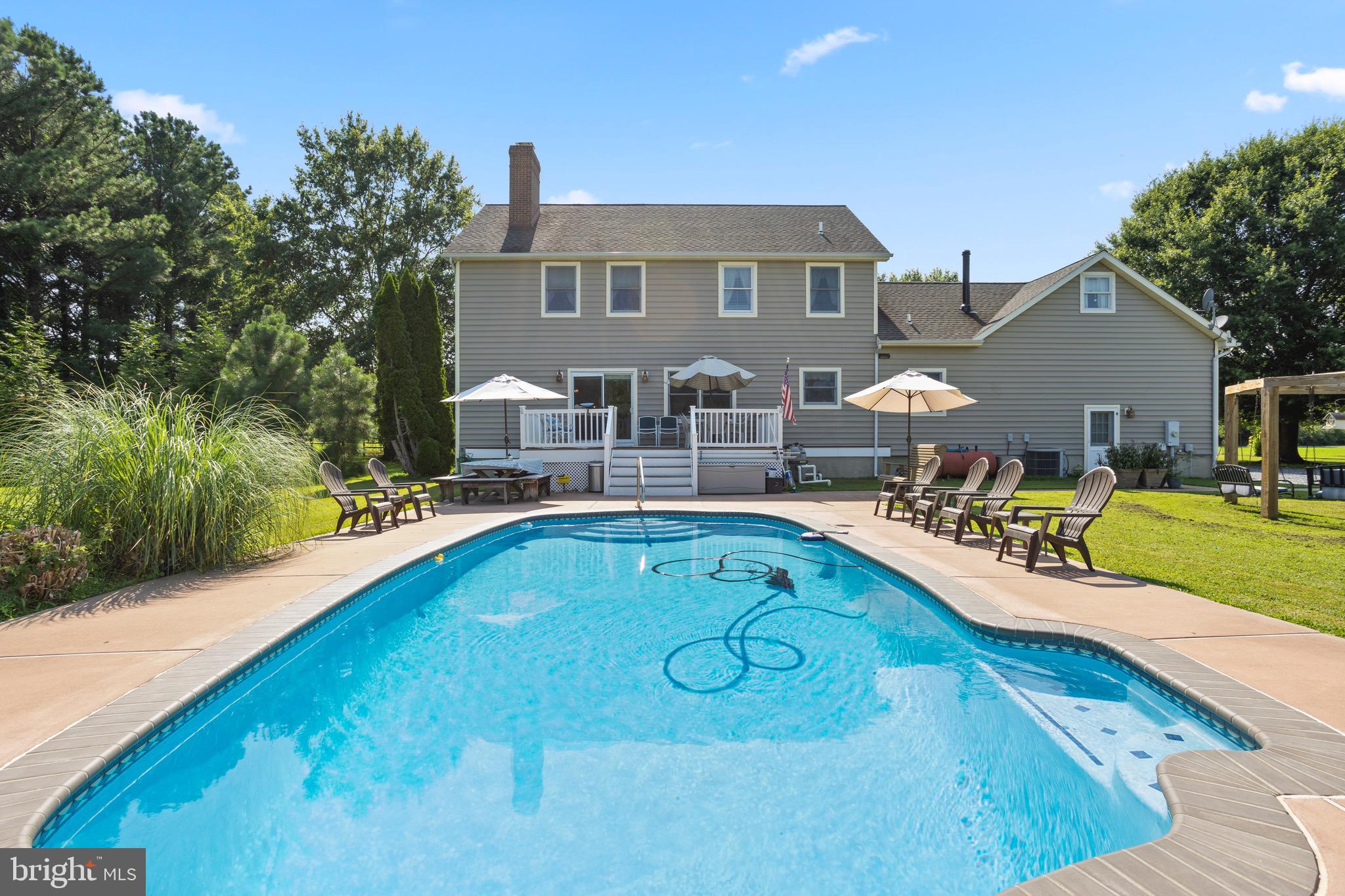 4957 Bar Neck Road Tilghman, MD 21671 - Photo 42 of 45 a view of a house with swimming pool and sitting area
