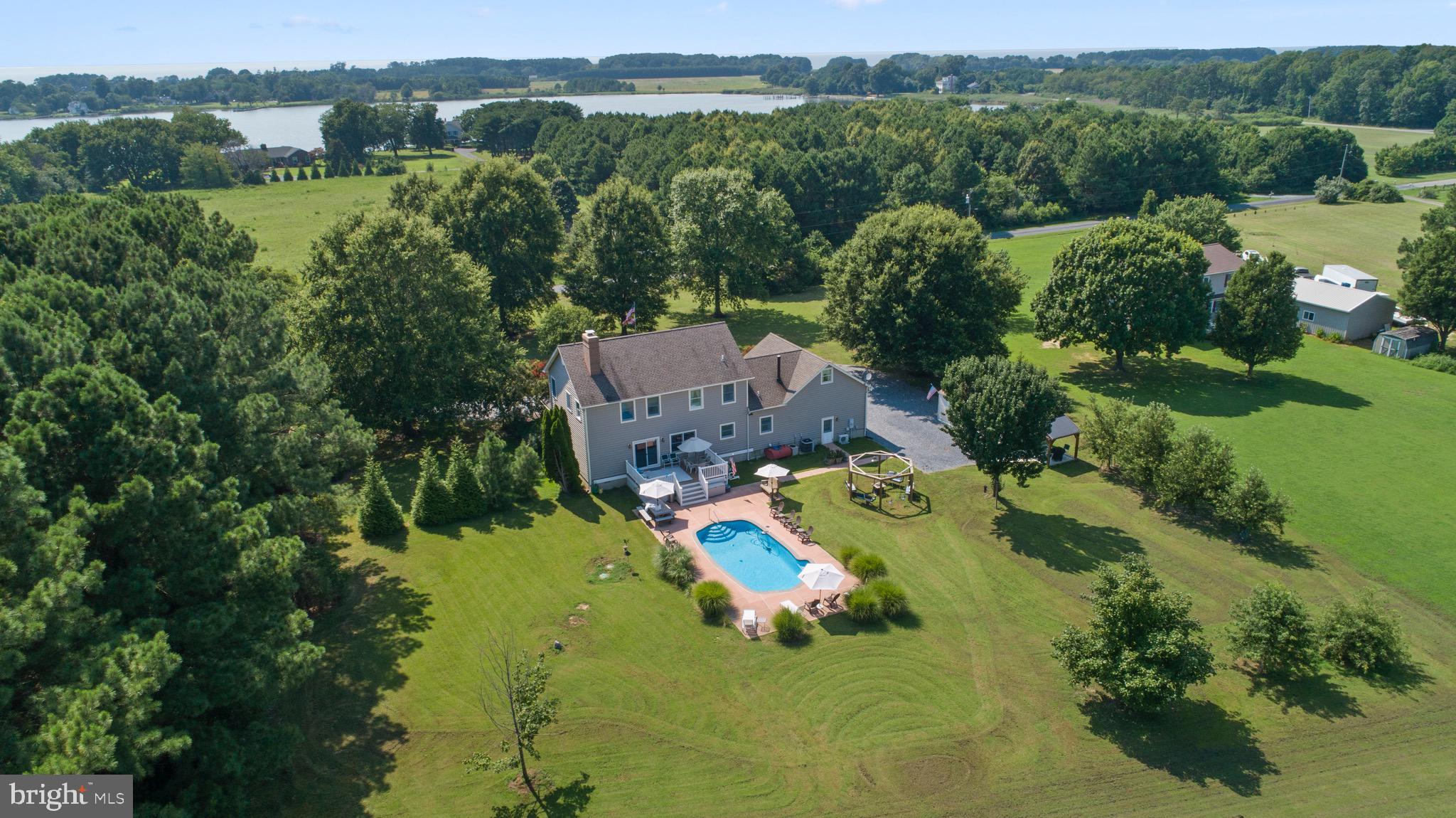 4957 Bar Neck Road Tilghman, MD 21671 - Photo 45 of 45 an aerial view of a house with a yard