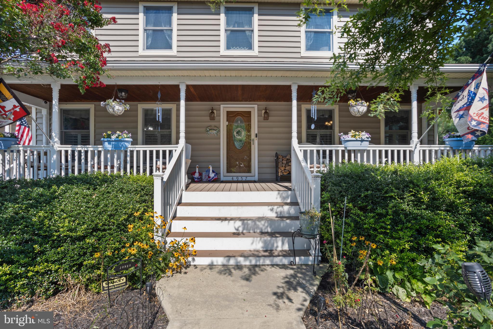 4957 Bar Neck Road Tilghman, MD 21671 - Photo 8 of 45 a view of a house with a small yard and plants