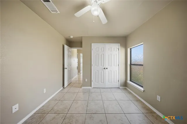 a view of a pathway with a yard