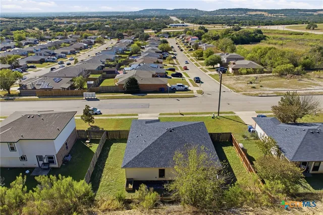 an aerial view of a house with a outdoor space