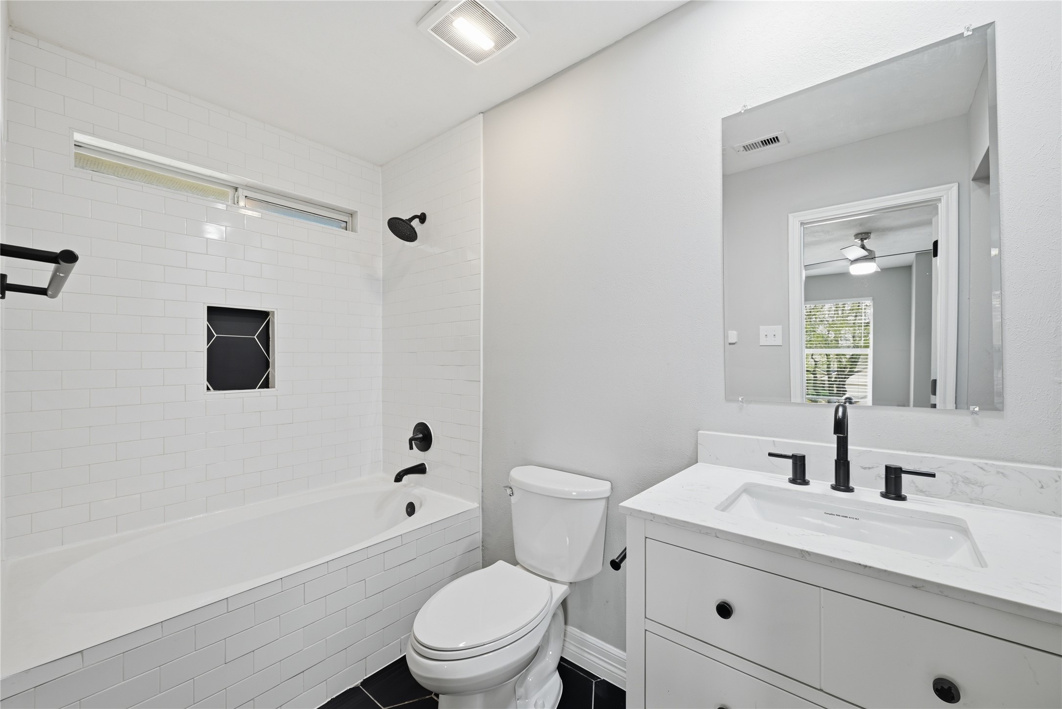 7218 Kransburg Ranch Drive Cypress, TX 77433 - Photo 19 of 27 a bathroom with a granite countertop toilet a sink a mirror and shower