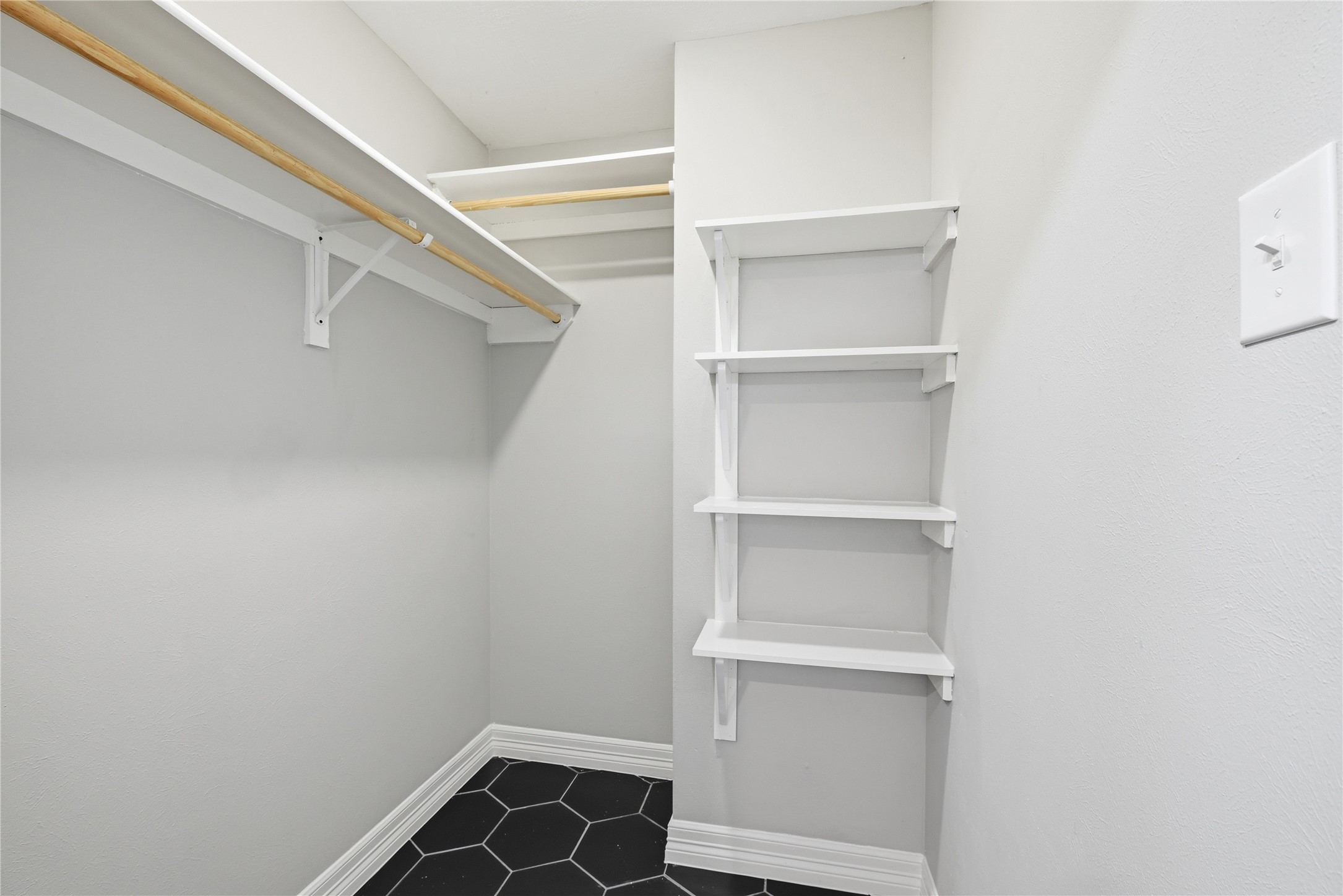 7218 Kransburg Ranch Drive Cypress, TX 77433 - Photo 20 of 27 a view of walk in closet with empty racks