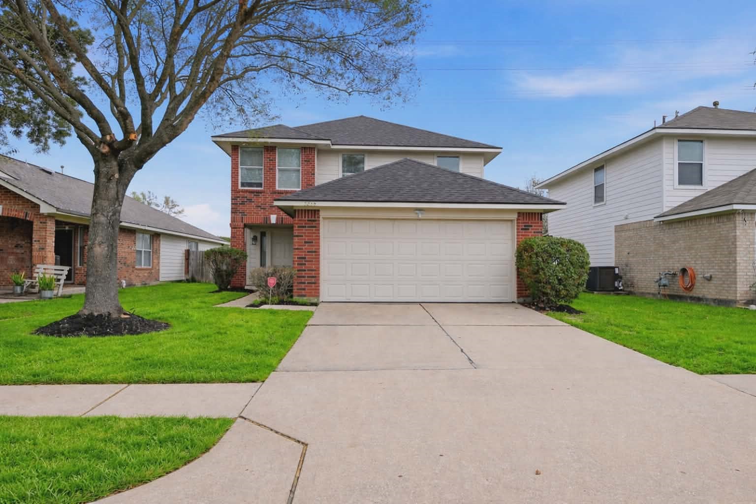 7218 Kransburg Ranch Drive Cypress, TX 77433 - Photo 2 of 27 a front view of a house with a yard