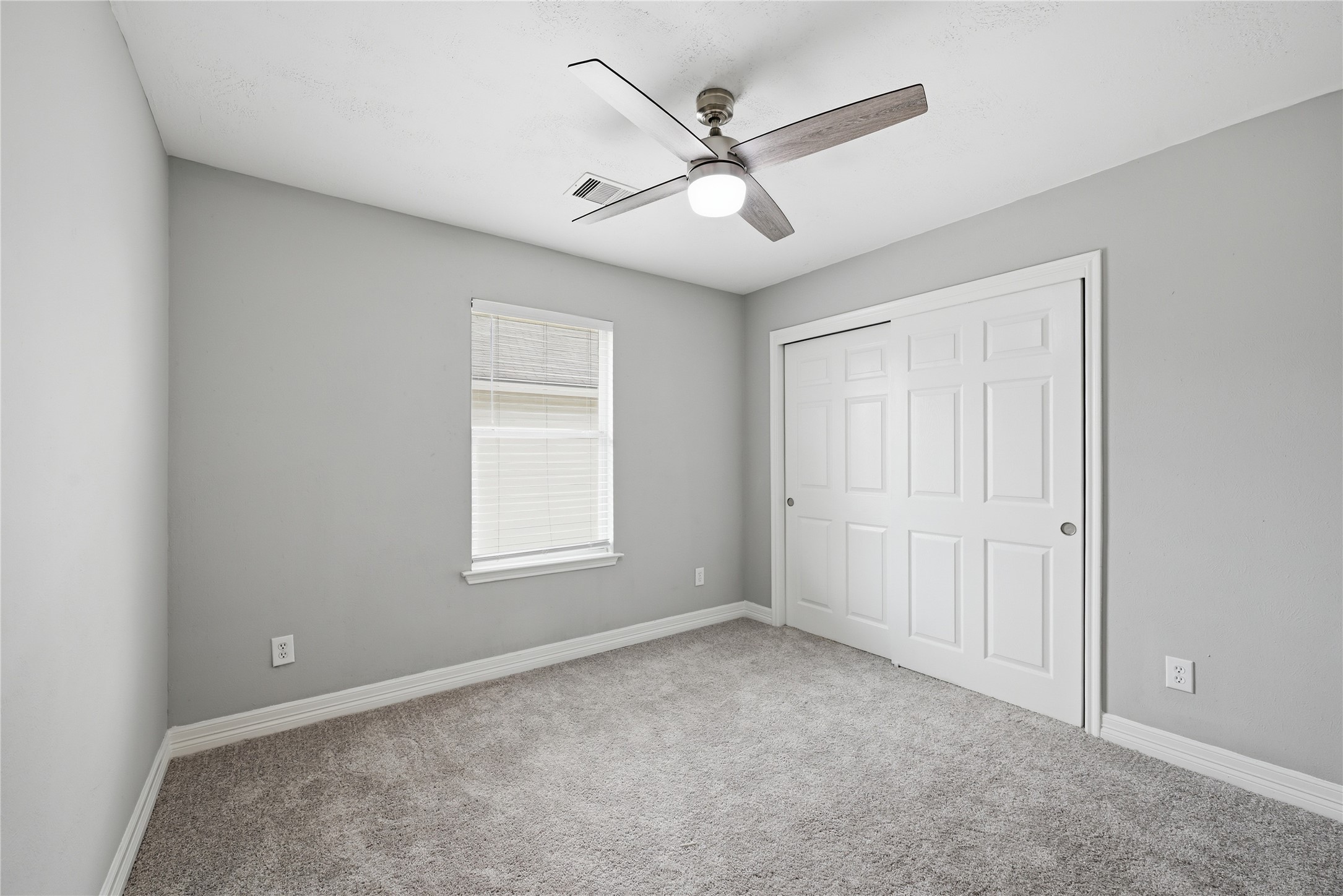 7218 Kransburg Ranch Drive Cypress, TX 77433 - Photo 21 of 27 a view of a livingroom with a ceiling fan & windows
