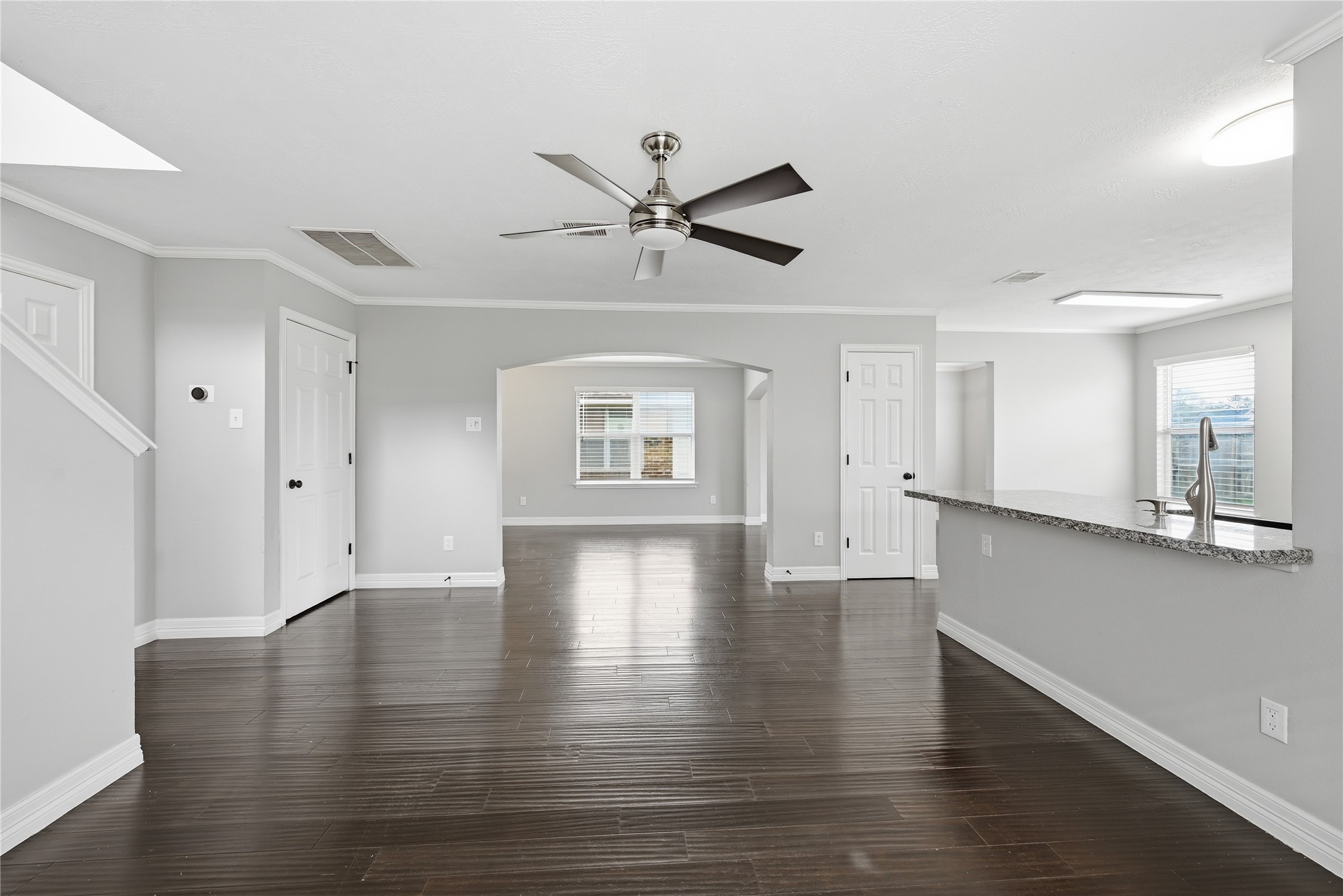 7218 Kransburg Ranch Drive Cypress, TX 77433 - Photo 4 of 27 a view of an empty room with window and wooden floor