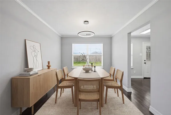 a view of a dining room with furniture and window