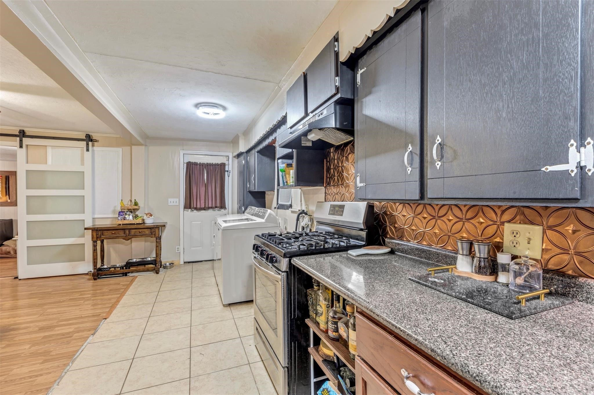 808 Morrell Street Baytown, TX 77520 - Photo 24 of 25 a kitchen with stainless steel appliances granite countertop a sink and cabinets