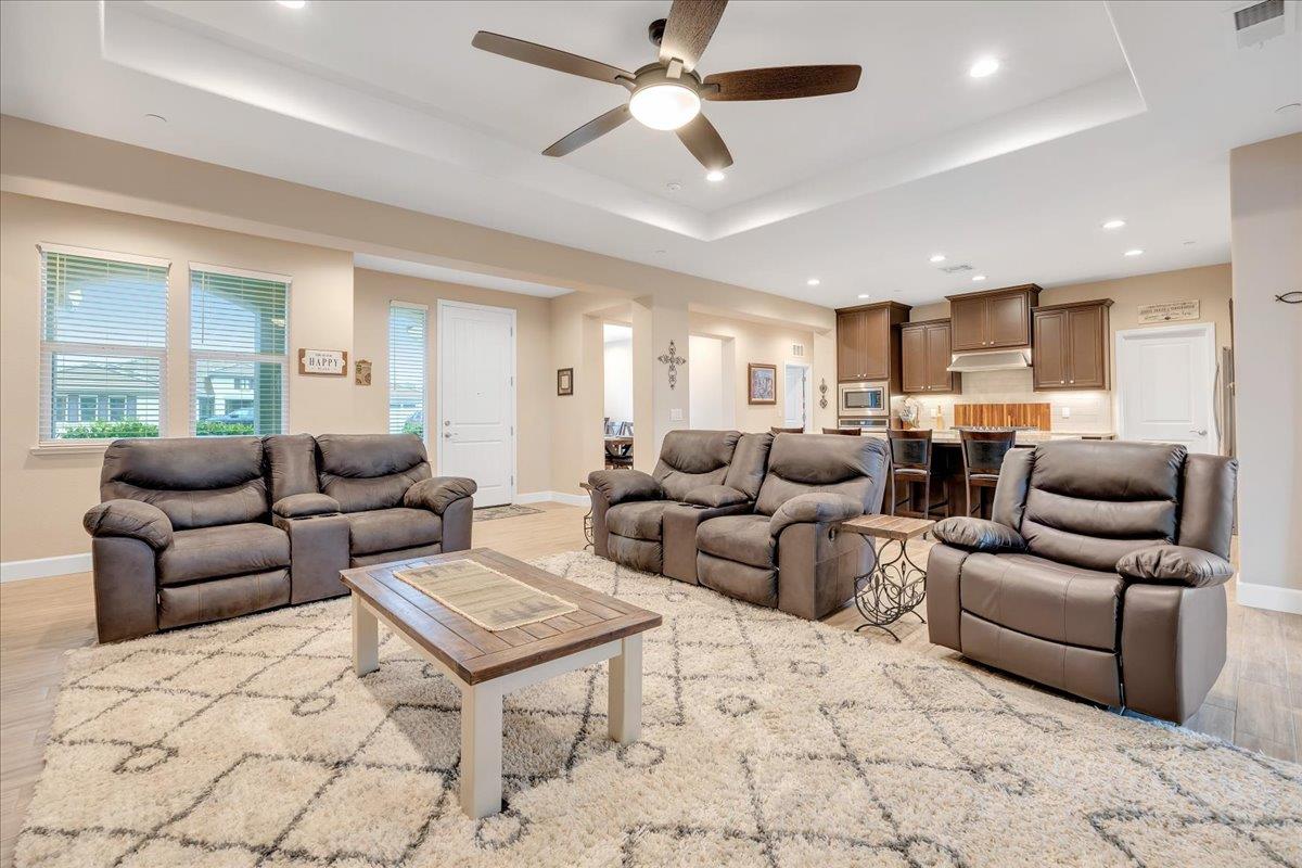 133 Palisades Place Copperopolis, CA 95228 - Photo 95 of 95 a living room with furniture and a chandelier