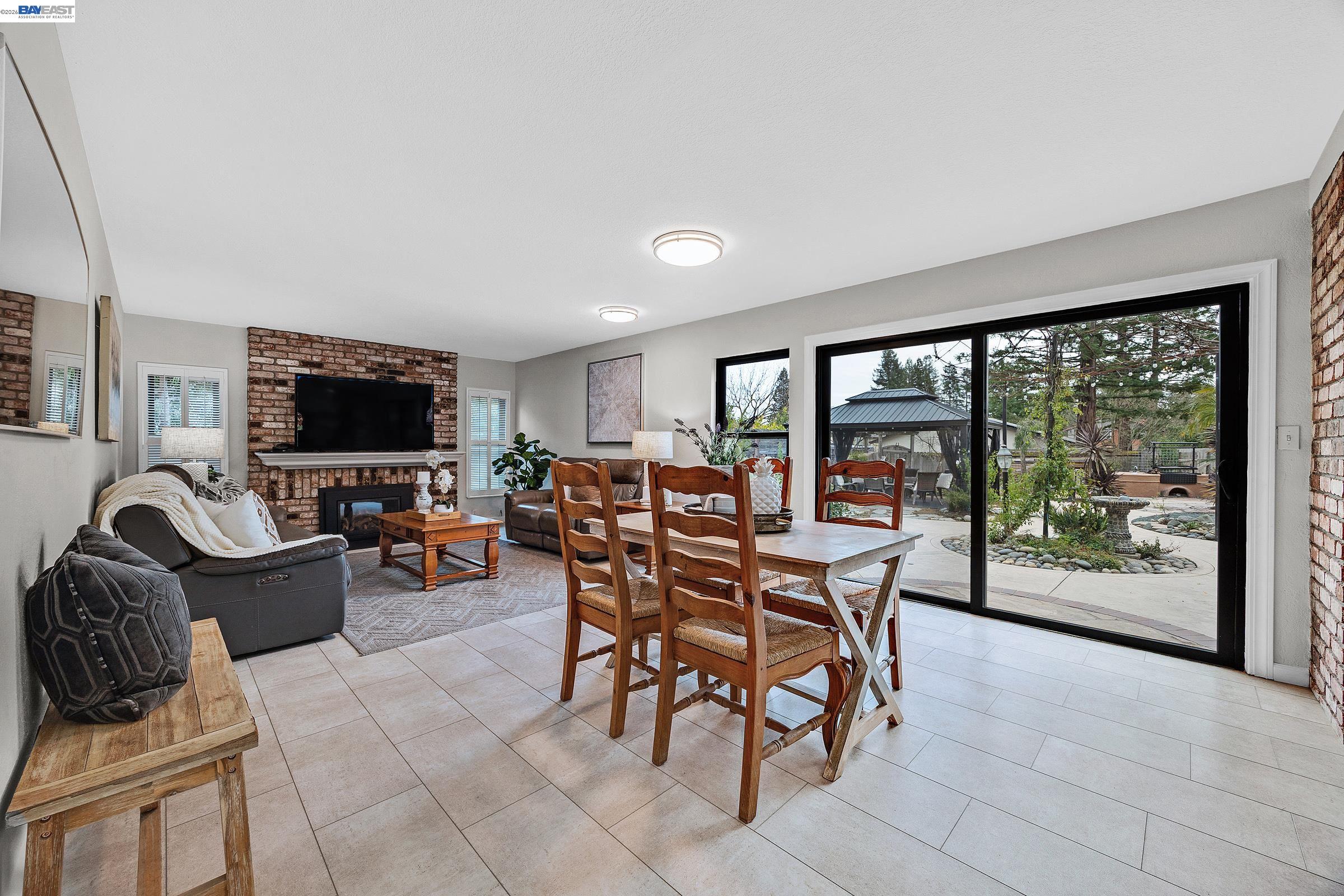 3020 Ascot Drive San Ramon, CA 94583 - Photo 17 of 45 a dining room with furniture and a flat screen tv
