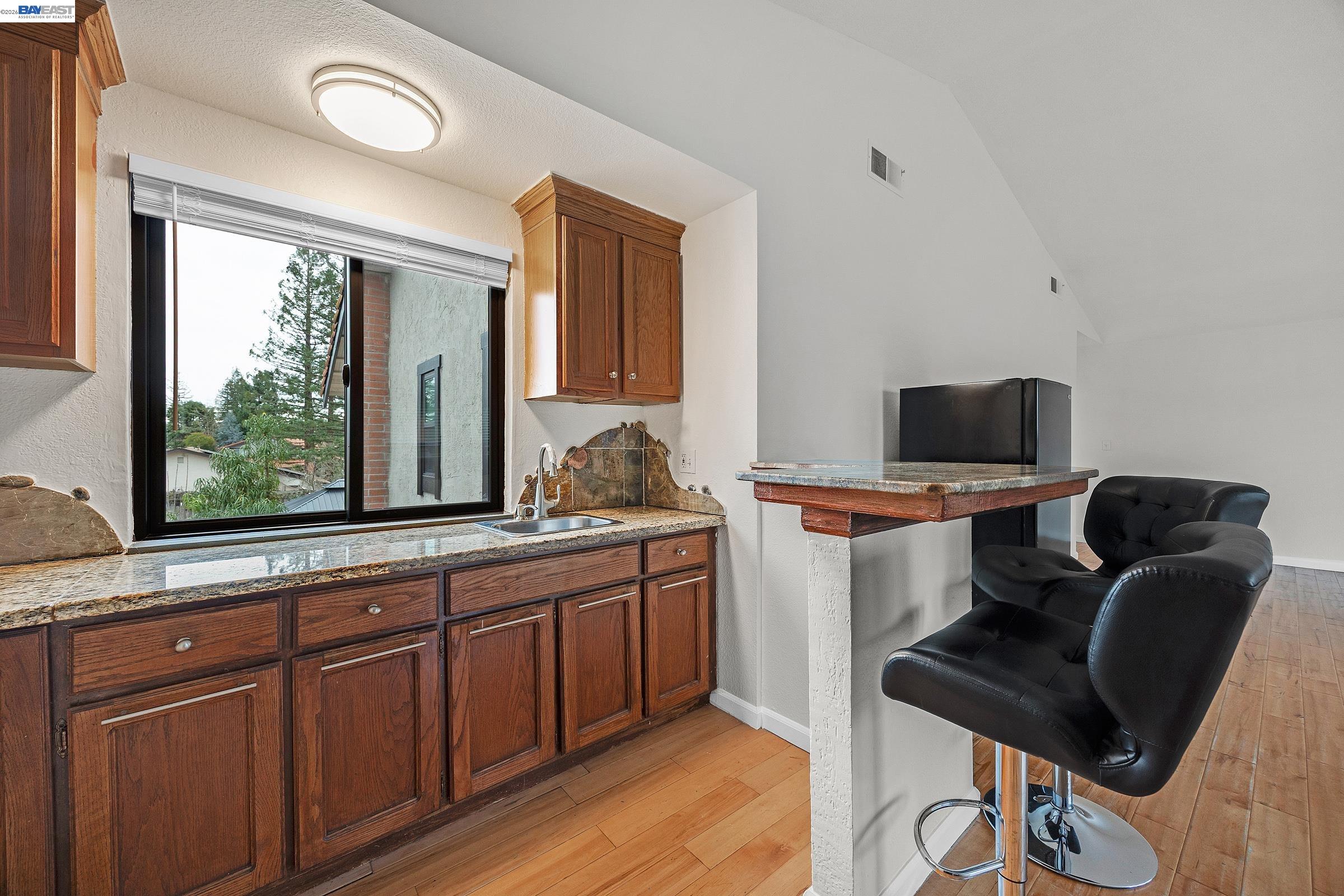 3020 Ascot Drive San Ramon, CA 94583 - Photo 33 of 45 a view of a workspace with furniture and a window