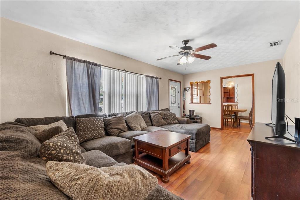 113 4th Street Winter Haven, FL 33880 - Photo 8 of 35 a living room with furniture and a flat screen tv