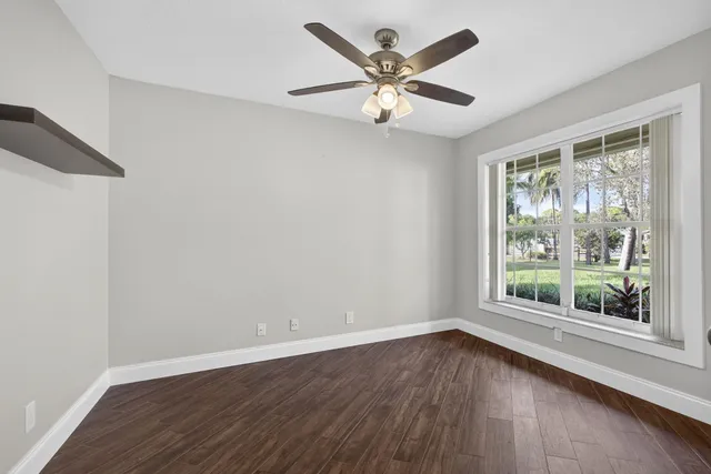 a bathroom with a sink double vanity granite and a mirror
