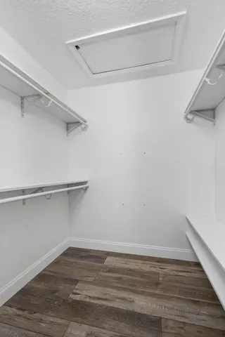 a bathroom with a double vanity sink mirror and shower