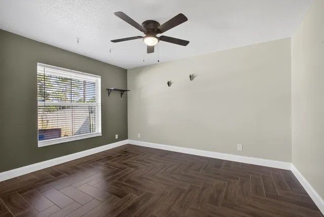 a view of an empty room with a window