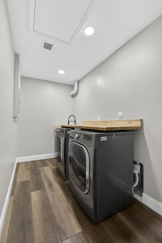a view of a patio with table and chairs with wooden floor and fence