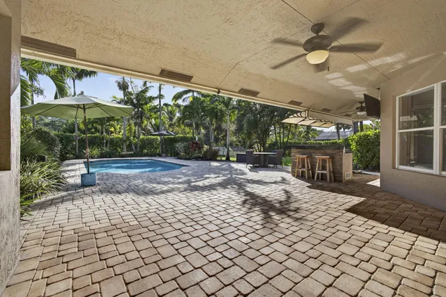 a kitchen with stainless steel appliances a stove a sink and a refrigerator