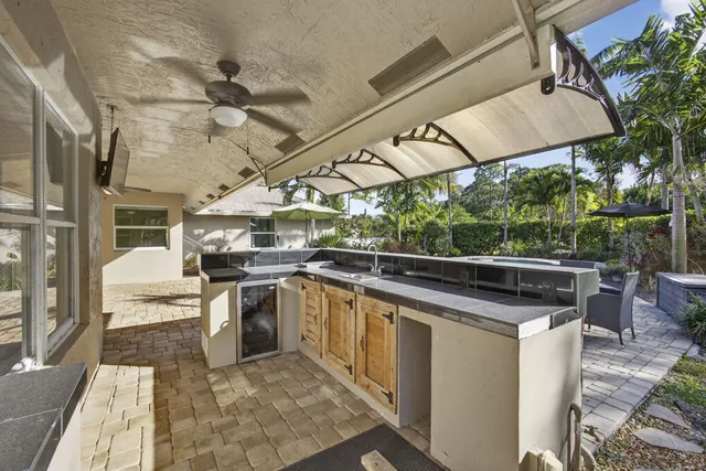 a view of a house with basketball court