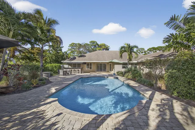 a view of swimming pool with a yard