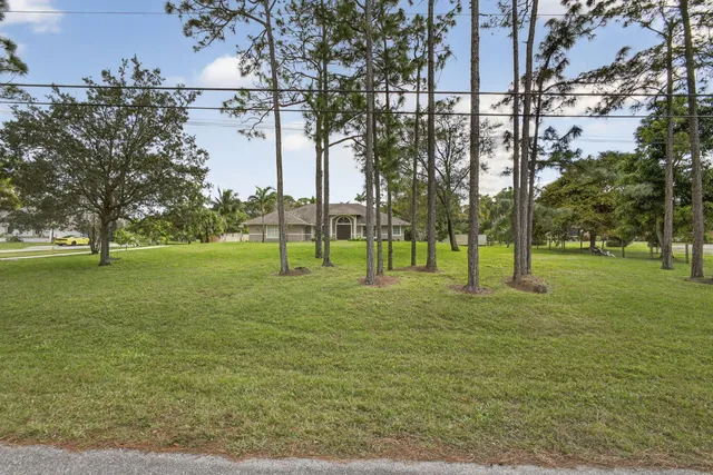 an aerial view of a house with pool