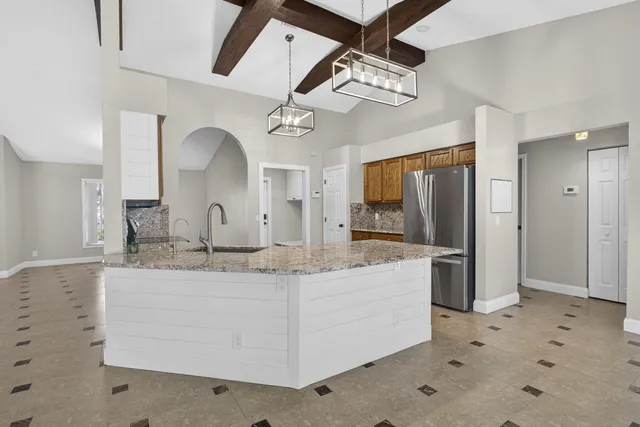 a view of a living room with a flat screen tv