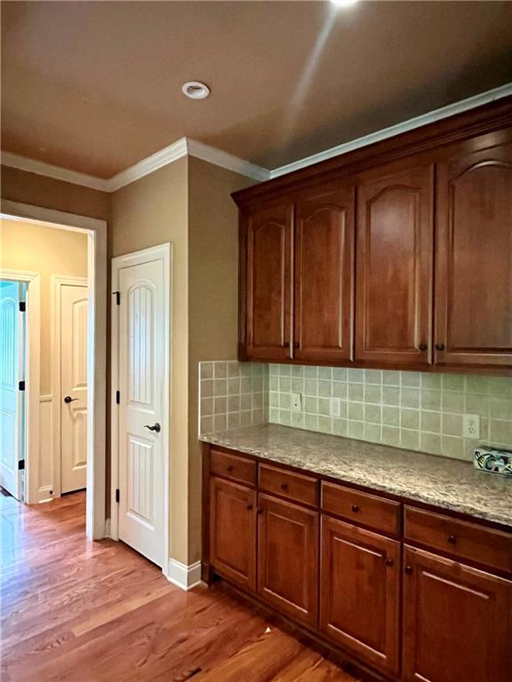 348 Hidden Trail Pendergrass, GA 30567 - Photo 19 of 40 a kitchen with wooden cabinets and a sink