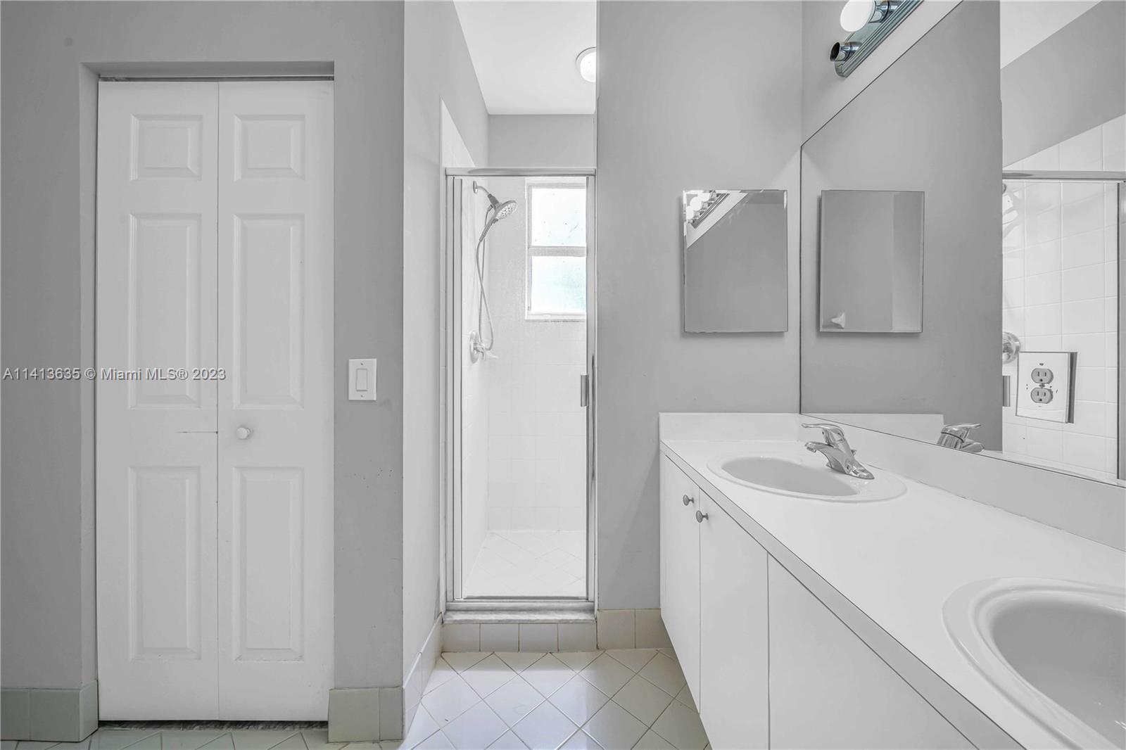 949 Northeast 42nd Avenue Homestead, FL 33033 - Photo 16 of 22 a bathroom with a sink and a mirror