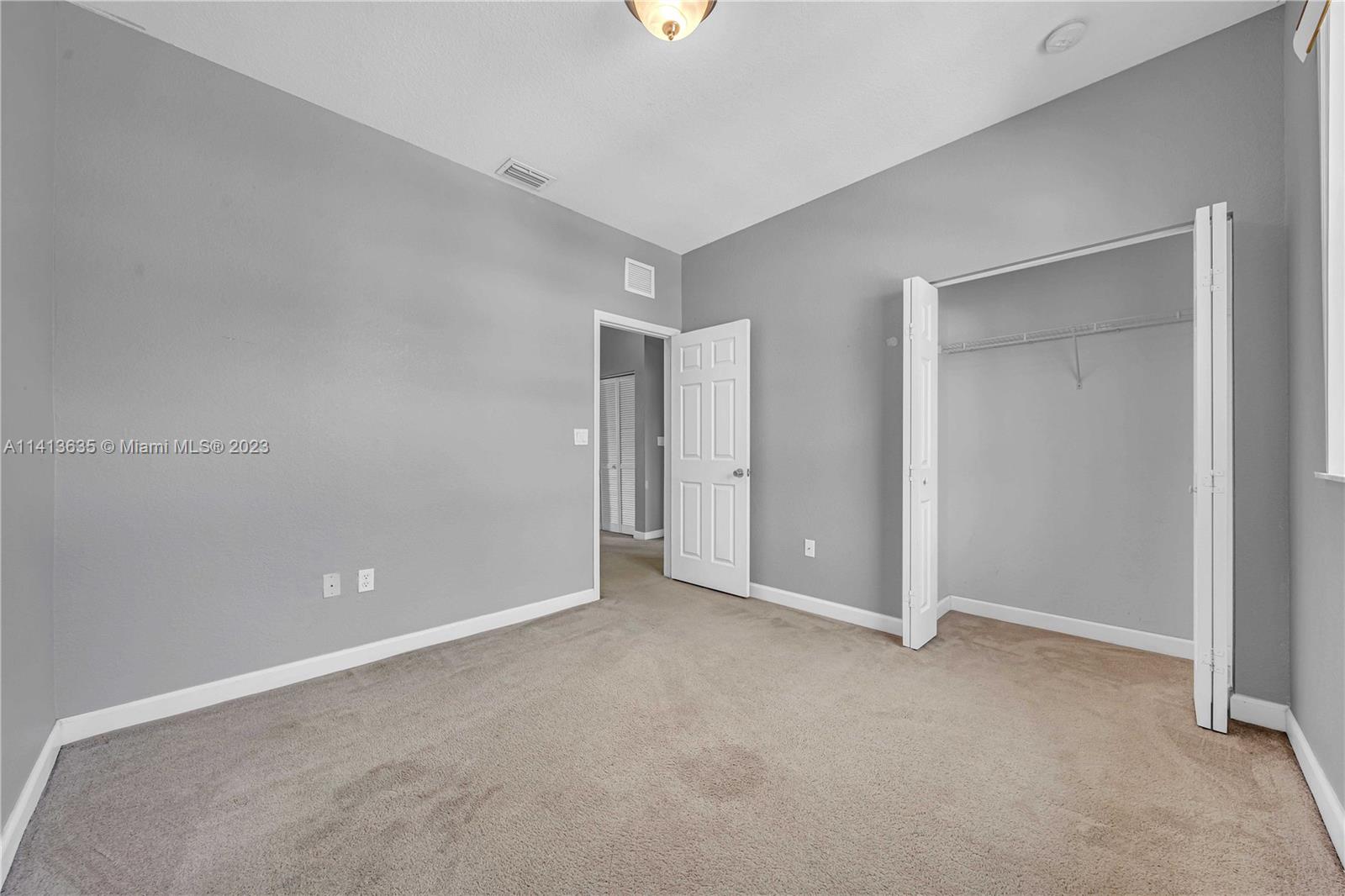 949 Northeast 42nd Avenue Homestead, FL 33033 - Photo 18 of 22 a view of an empty room with a window