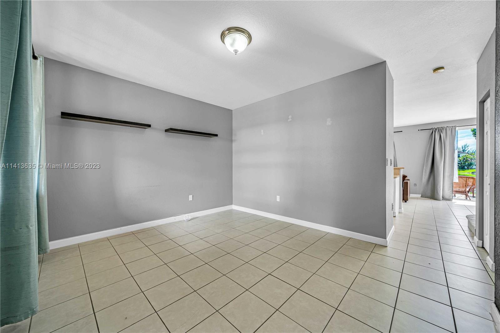 949 Northeast 42nd Avenue Homestead, FL 33033 - Photo 3 of 22 a view of an empty room