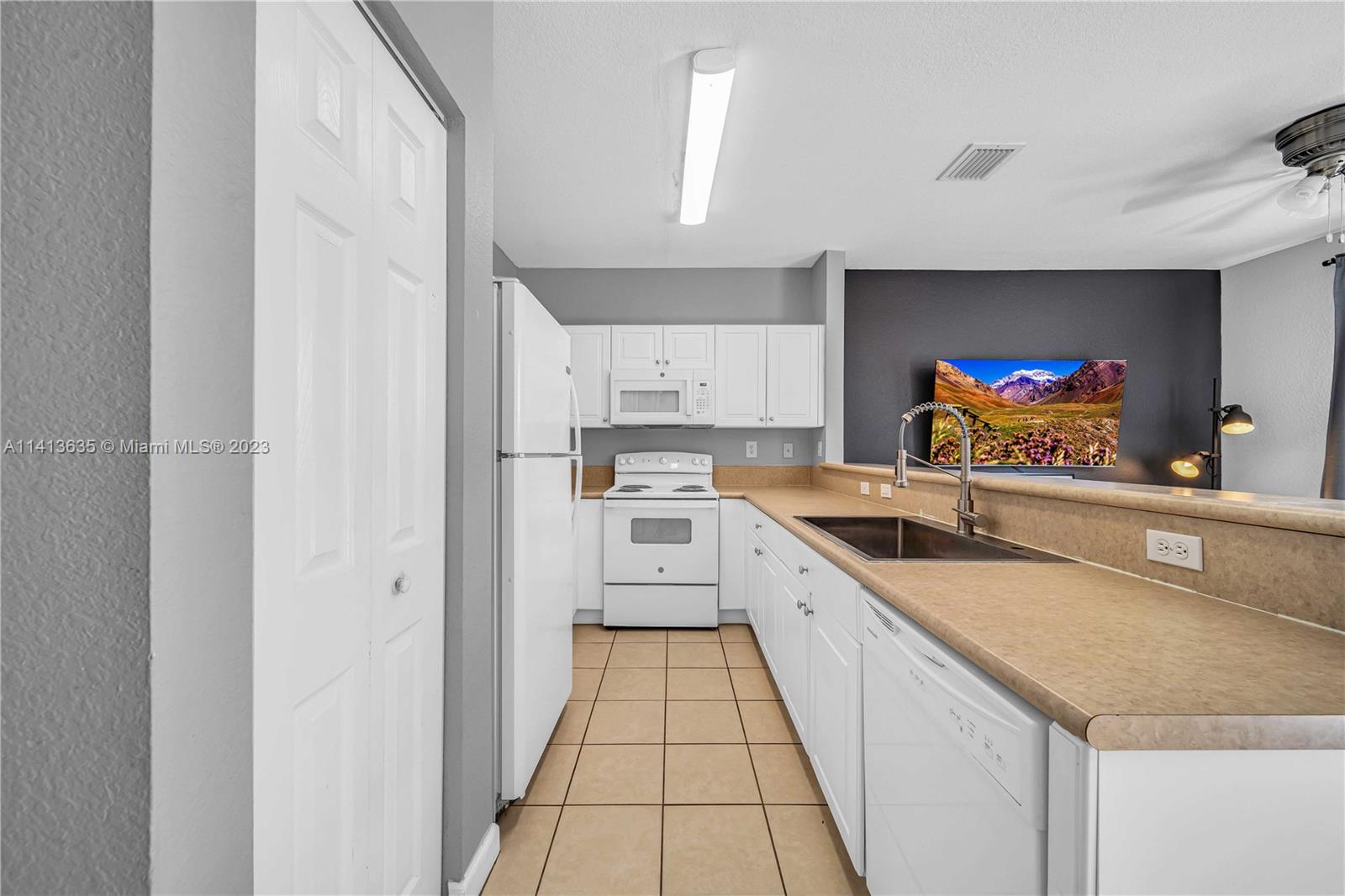 949 Northeast 42nd Avenue Homestead, FL 33033 - Photo 6 of 22 a view of a kitchen with a sink and cabinets